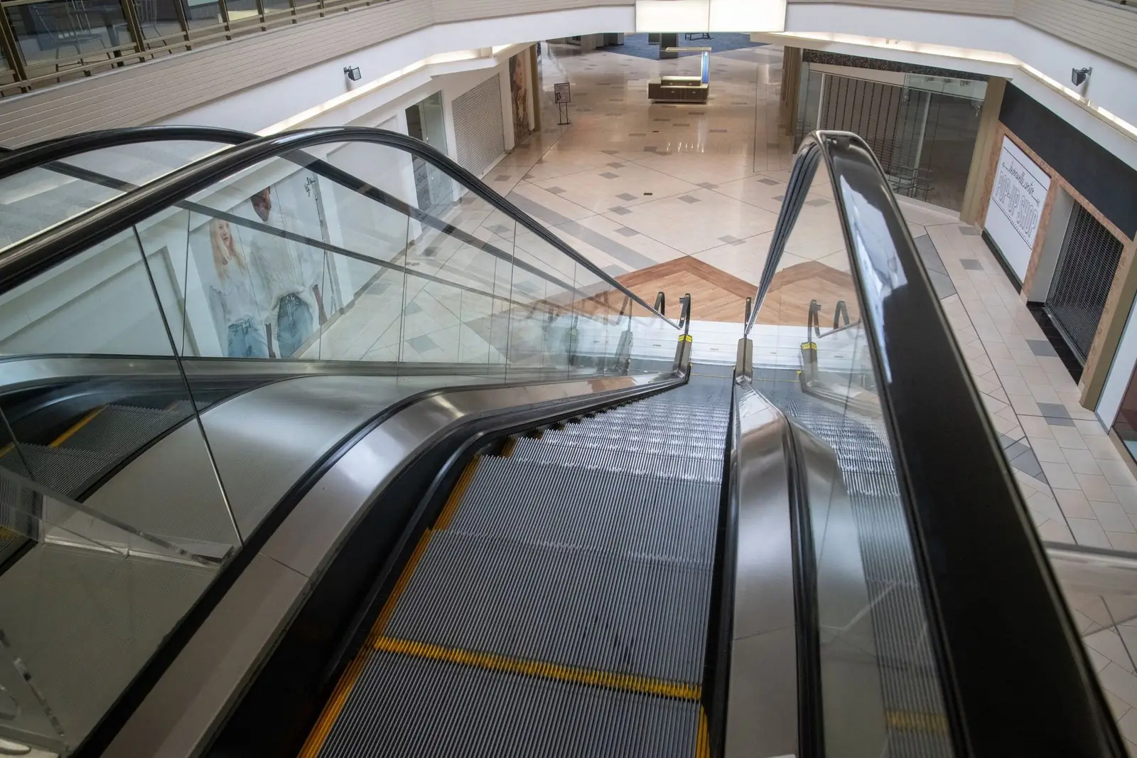 Escalators in an empty shopping mall